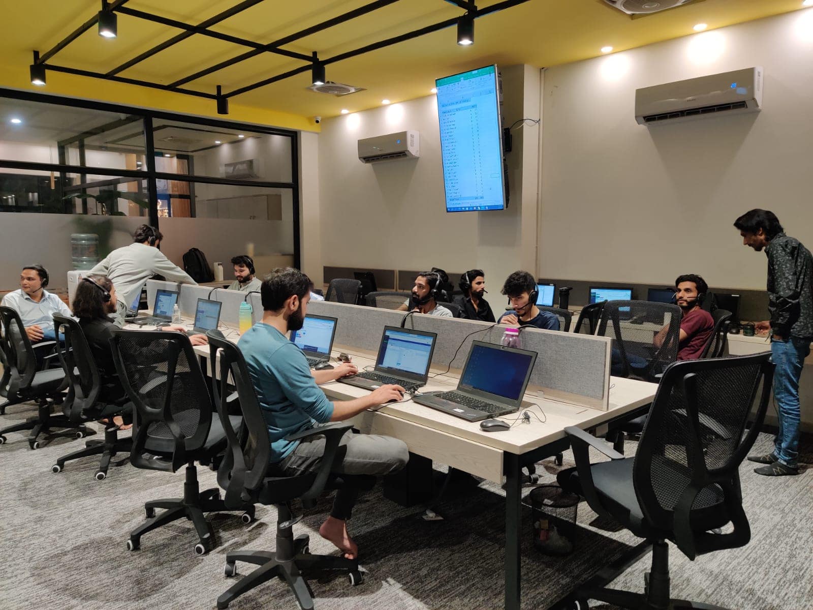 Agents working at their desks on the operations floor