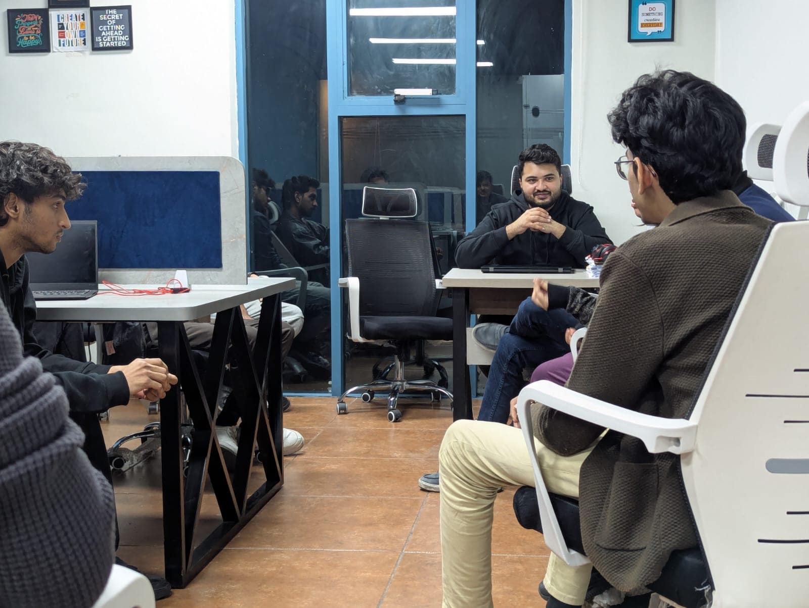 Team members having a huddle discussion